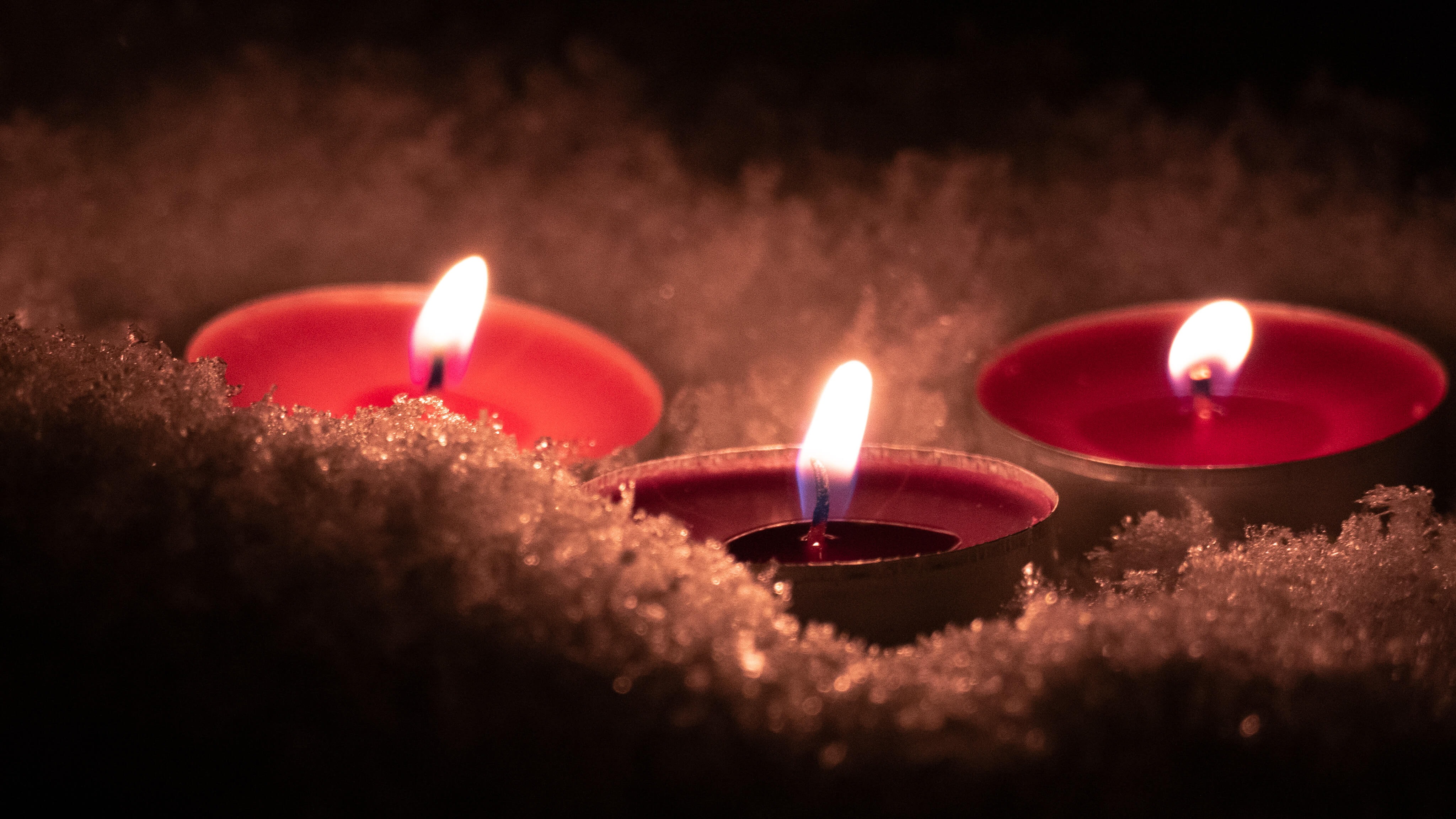 red tealights in snow